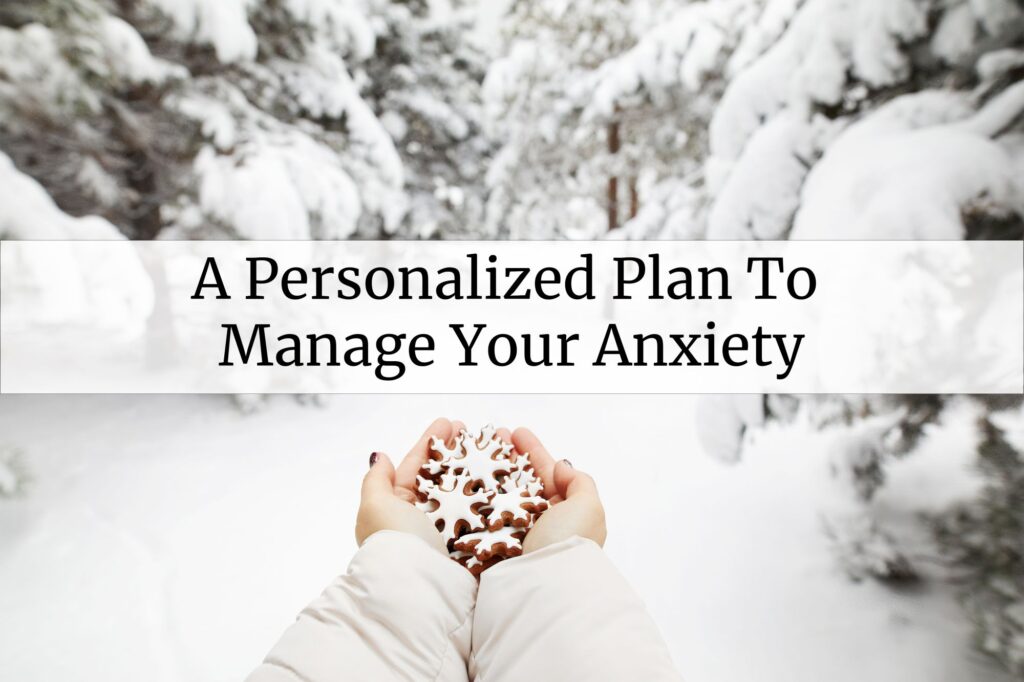 Two hands cupped, holding a handful of sugar-frosted gingerbread cookies shaped like snowflakes. The background shows a forest. The ground is covered in snow, as well as the branches of the trees. 
Overlaying the photo there's a text banner saying "A personalized plan to manage your anxiety"